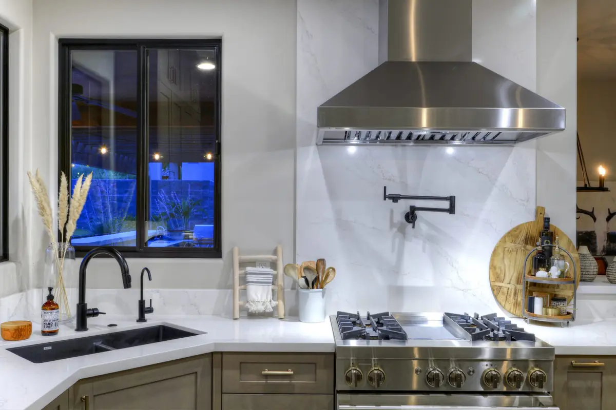 Finished kitchen with range, hood and window